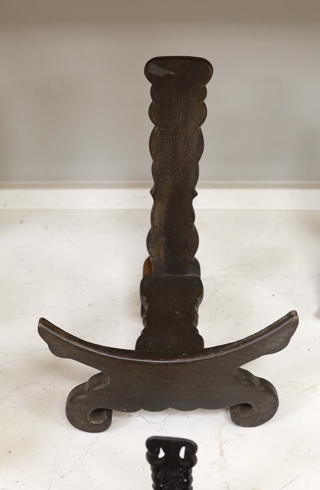 Two Chinese hardwood plate stands and a fret cut rosewood letter rack, 26cm wide